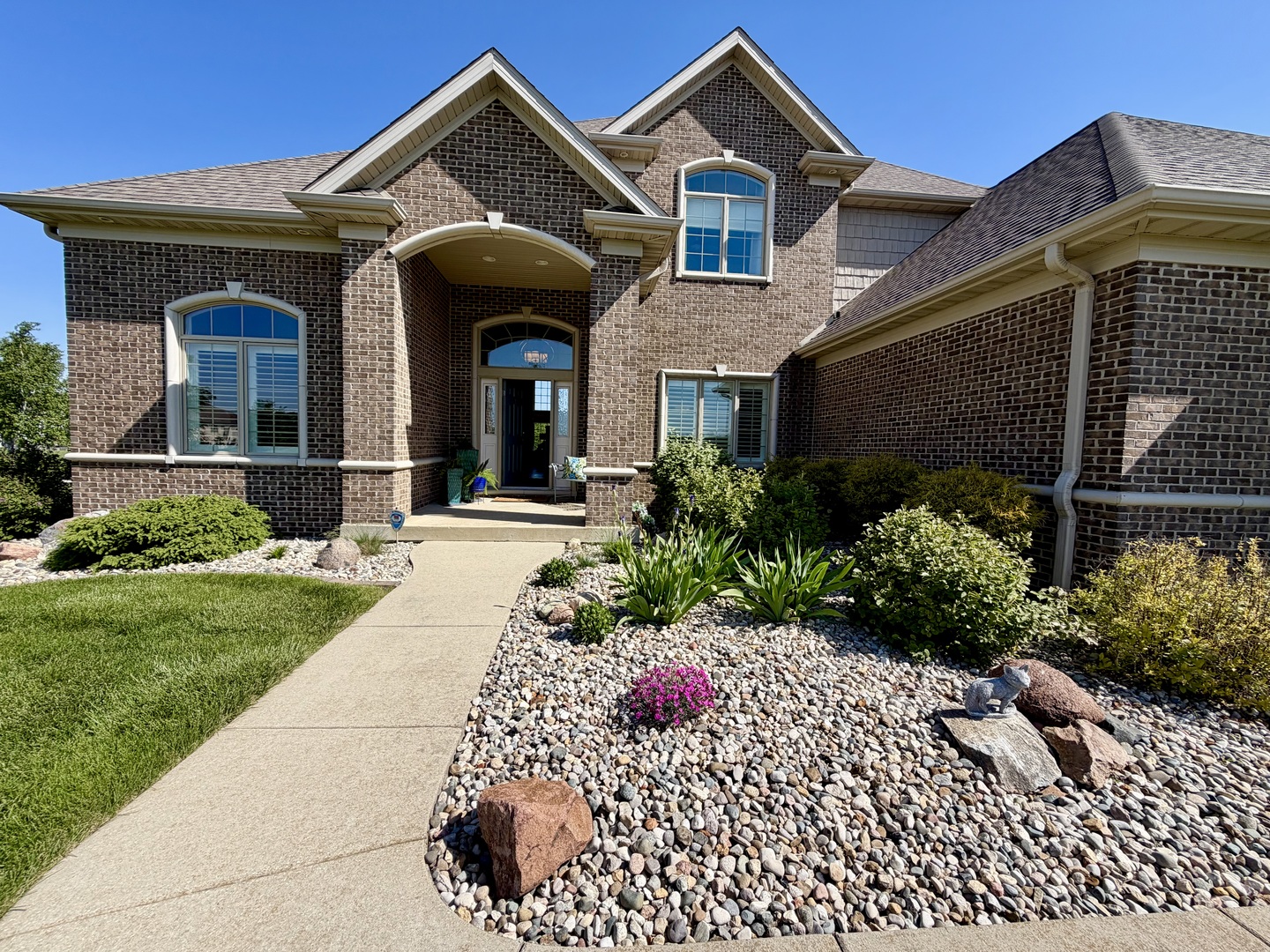 400 Constitution Boulevard Monticello, IL 61856 - Photo 2 of 58 a front view of a house with a yard