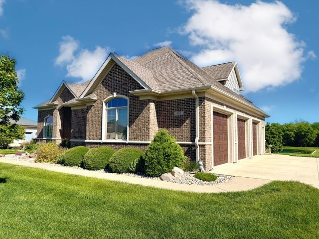400 Constitution Boulevard Monticello, IL 61856 - Photo 3 of 58 a front view of a house with a yard