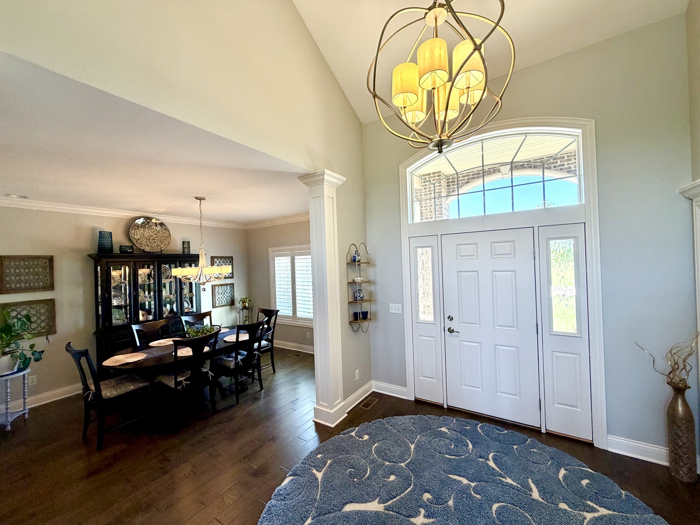 400 Constitution Boulevard Monticello, IL 61856 - Photo 8 of 58 a living room with furniture a chandelier and a floor to ceiling window