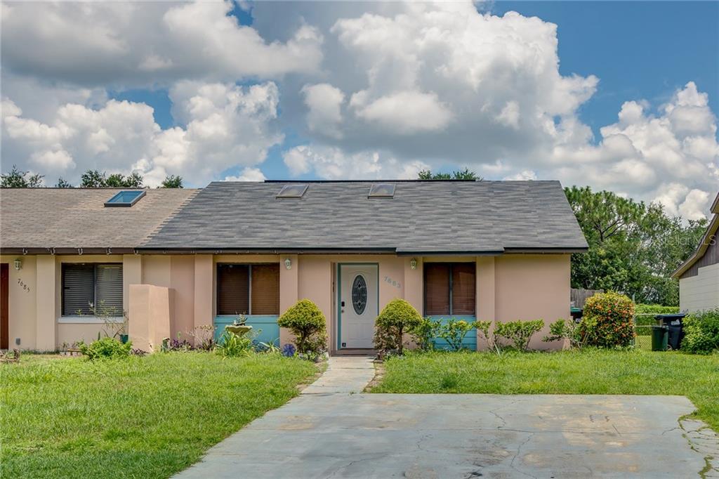 7683 Timber River Circle Orlando, FL 32807 - Photo 1 of 1 a front view of house with a garden