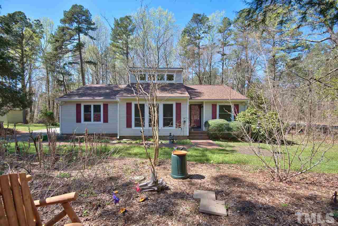 6017 Crabapple Road Durham, NC 27712 - Photo 1 of 18 a front view of a house with a yard
