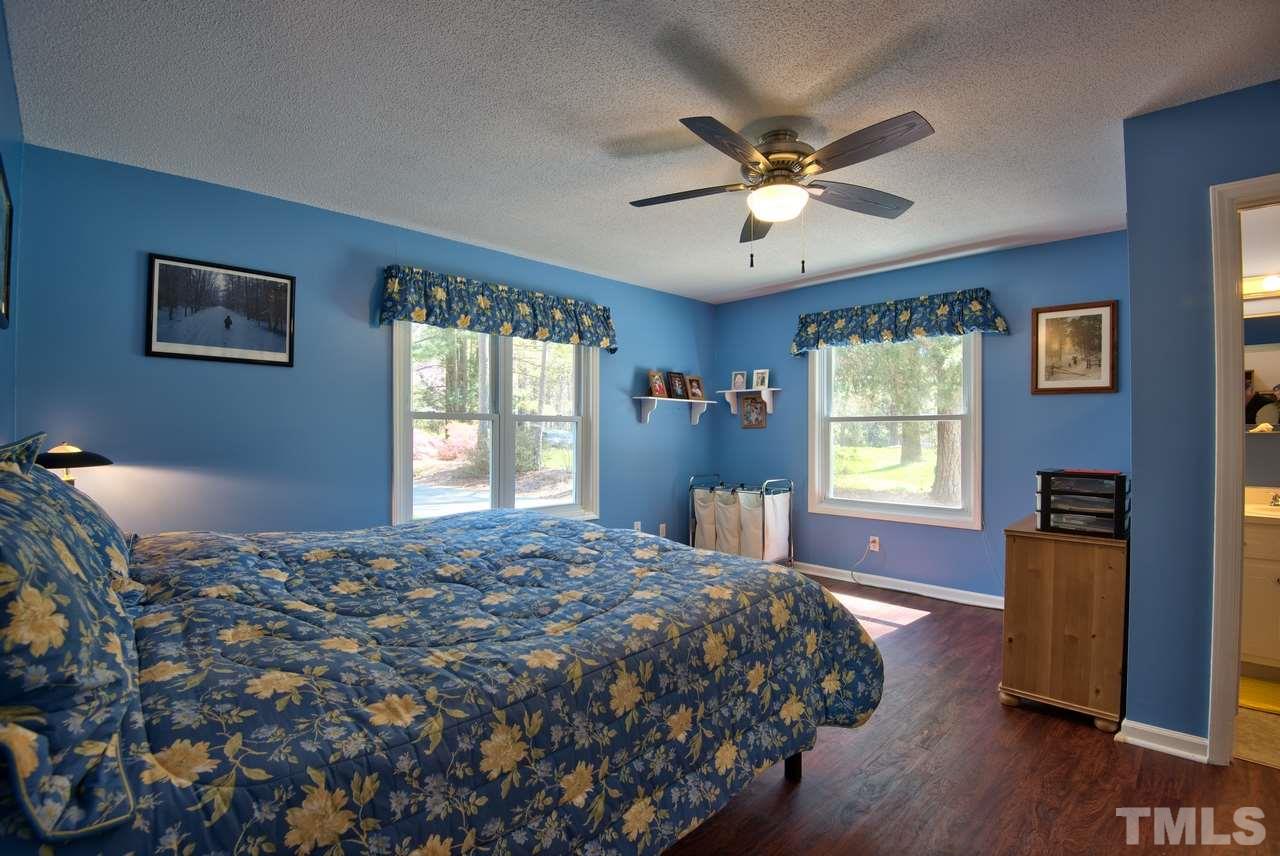 6017 Crabapple Road Durham, NC 27712 - Photo 14 of 18 a bedroom with a bed and a window