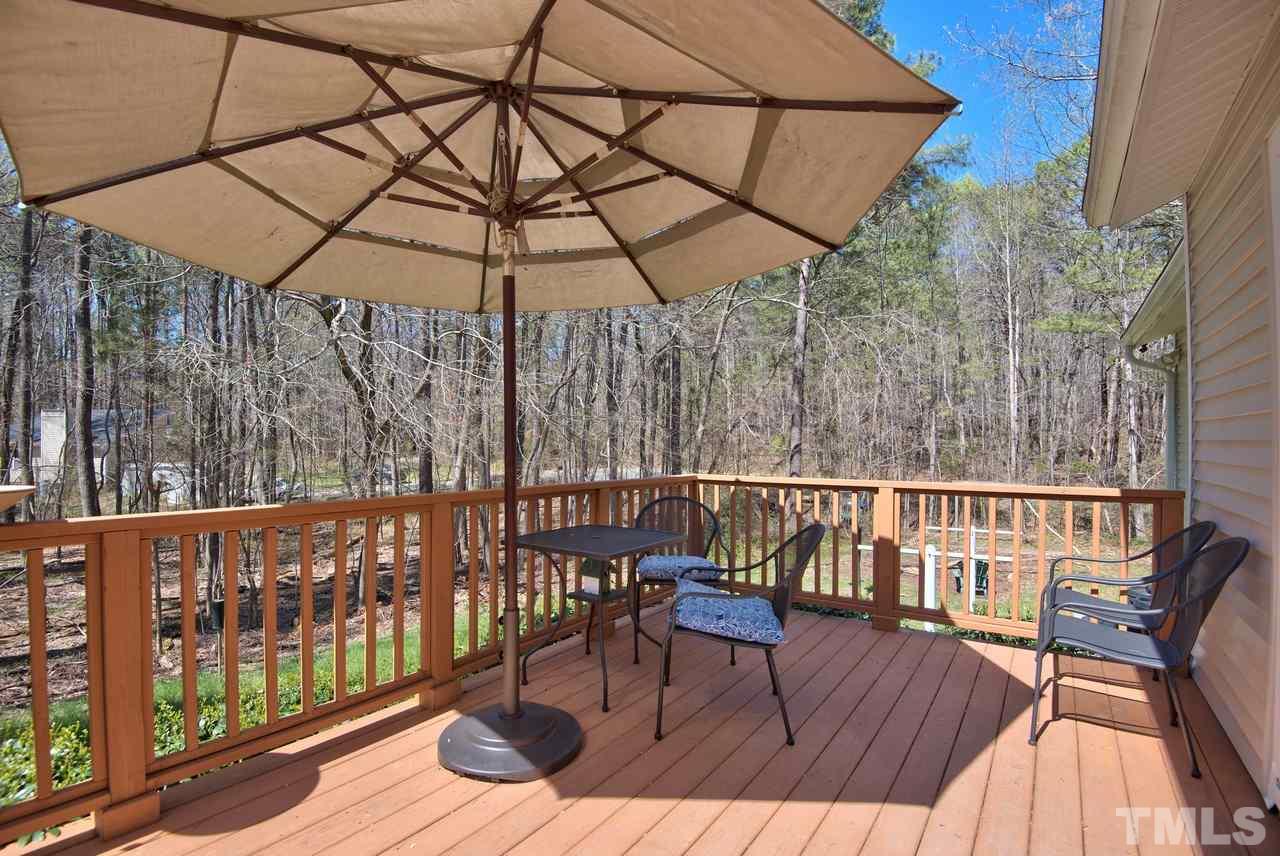 6017 Crabapple Road Durham, NC 27712 - Photo 17 of 18 a view of balcony with wooden floor and outdoor seating