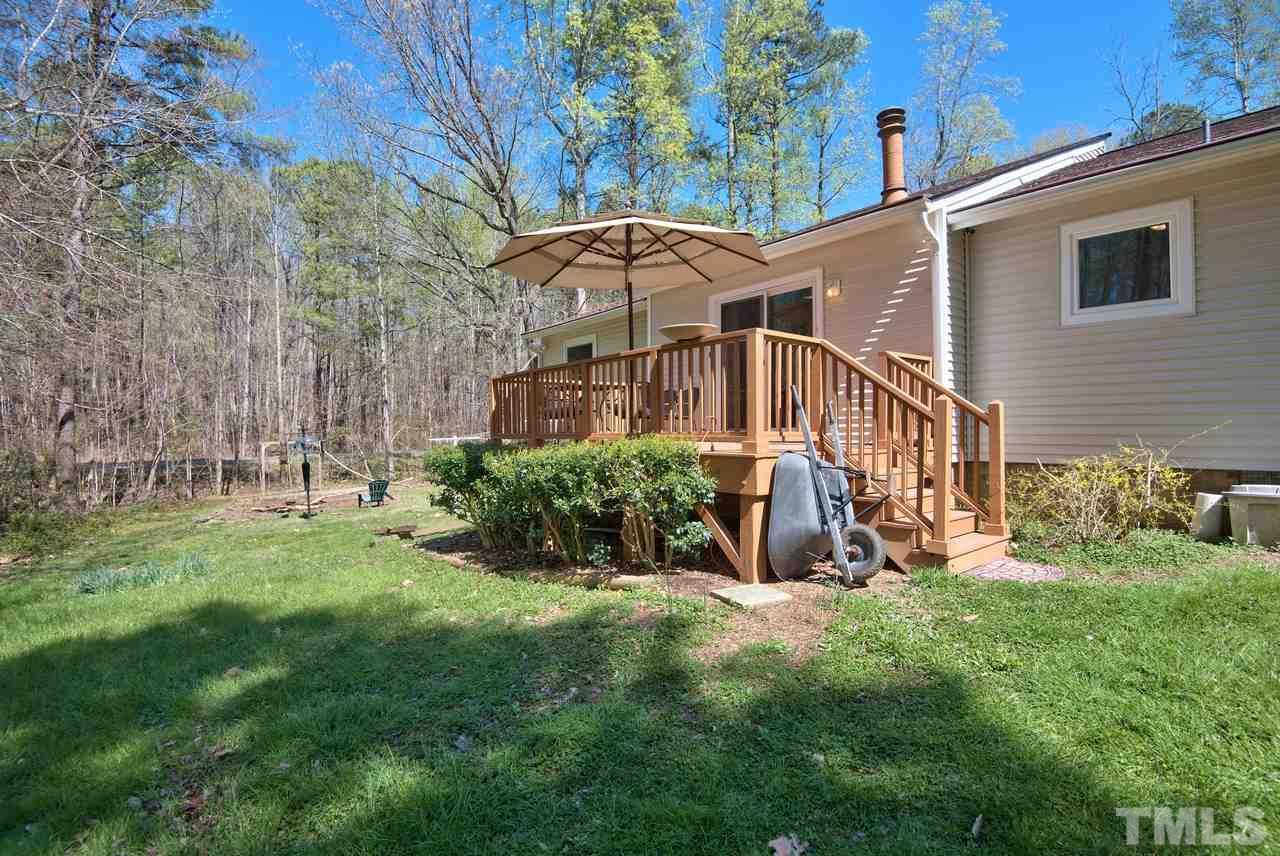 6017 Crabapple Road Durham, NC 27712 - Photo 18 of 18 a view of a house with backyard and garden