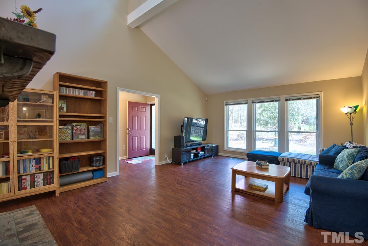 6017 Crabapple Road Durham, NC 27712 - Photo 8 of 18 a living room with furniture and a flat screen tv