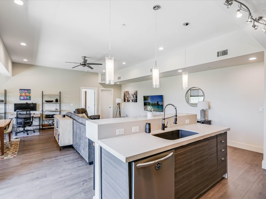 604 North Bluff Drive, Unit 101 Austin, TX 78745 - Photo 22 of 22 a kitchen with a sink cabinets and wooden floor
