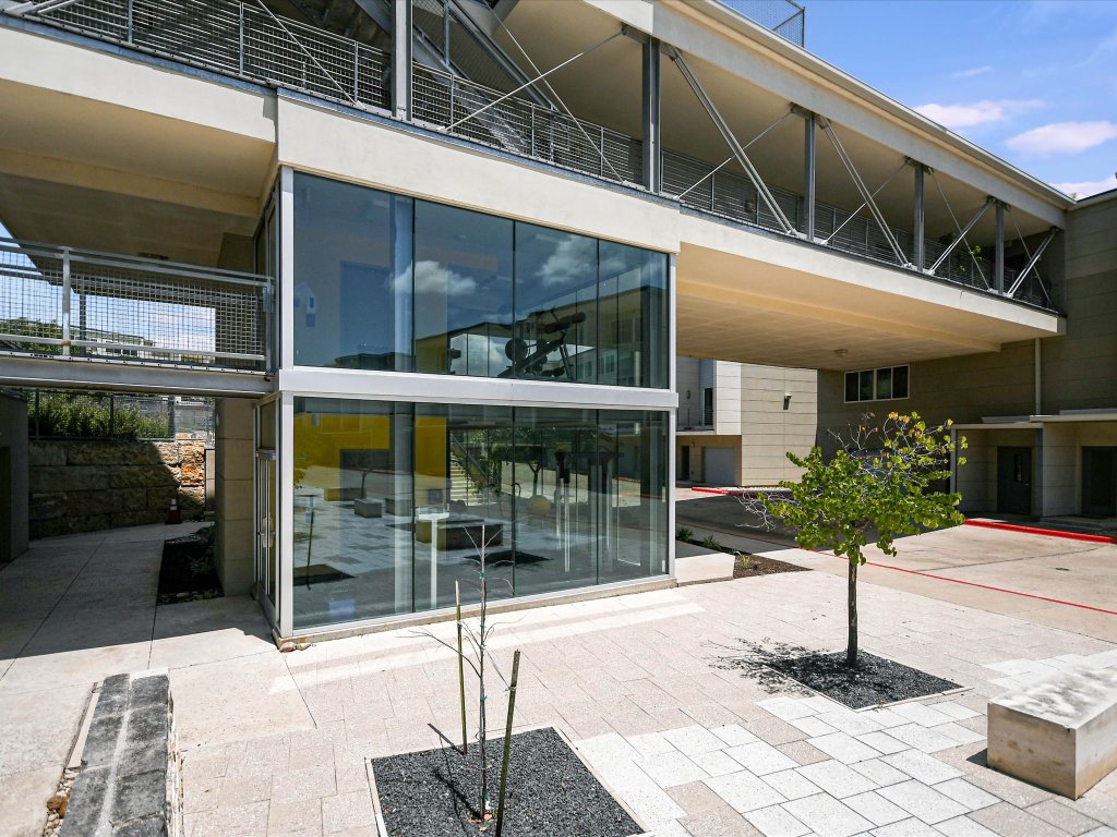 604 North Bluff Drive, Unit 101 Austin, TX 78745 - Photo 19 of 22 a outdoor view of a building with a entrance door