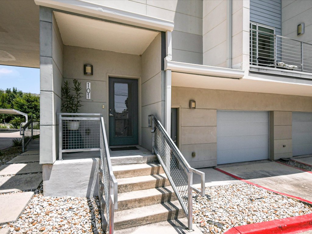 604 North Bluff Drive, Unit 101 Austin, TX 78745 - Photo 5 of 22 a front view of a house with a balcony