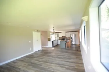 a view of a living room with a wooden floor