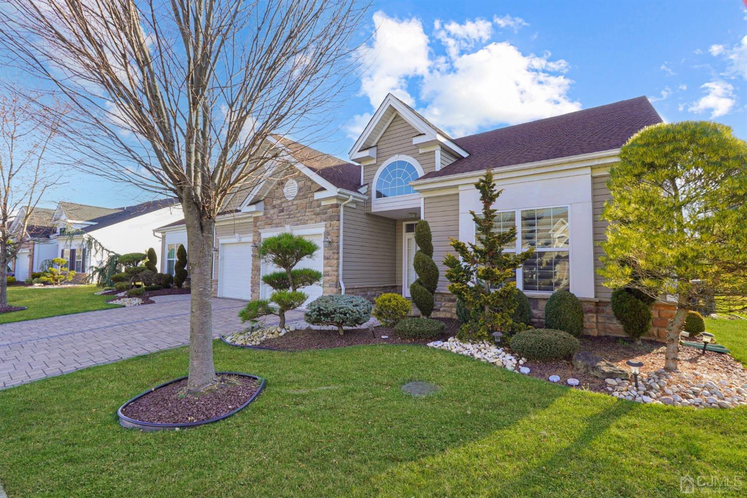 a front view of a house with garden