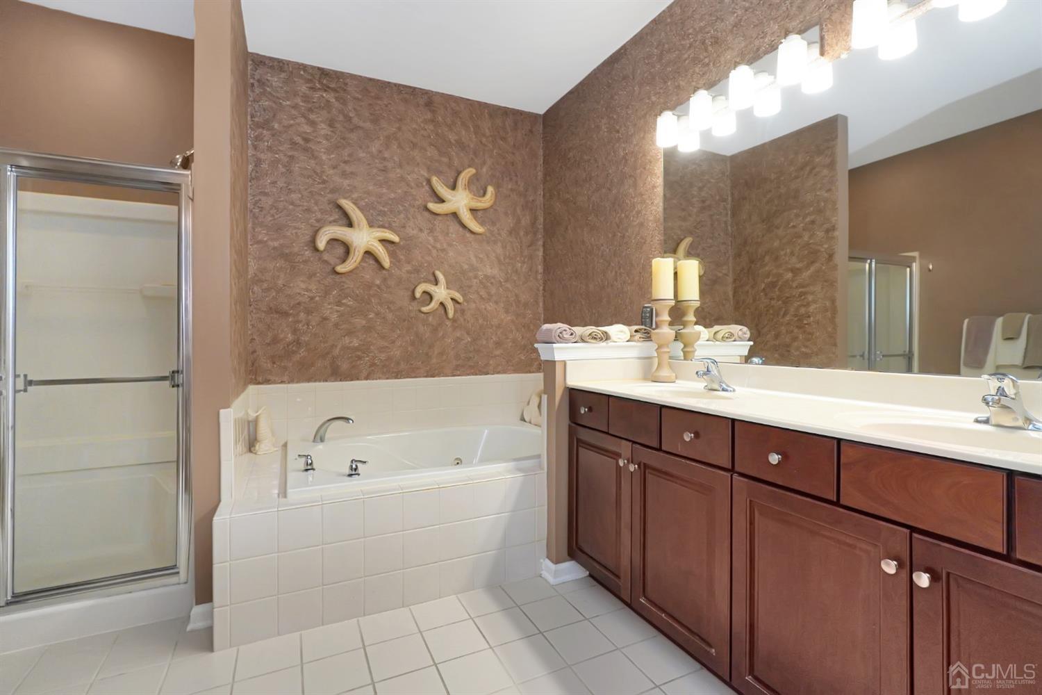 35 Diamond Spring Drive Monroe Township, NJ 08831 - Photo 13 of 32 a bathroom with a tub sink and mirror