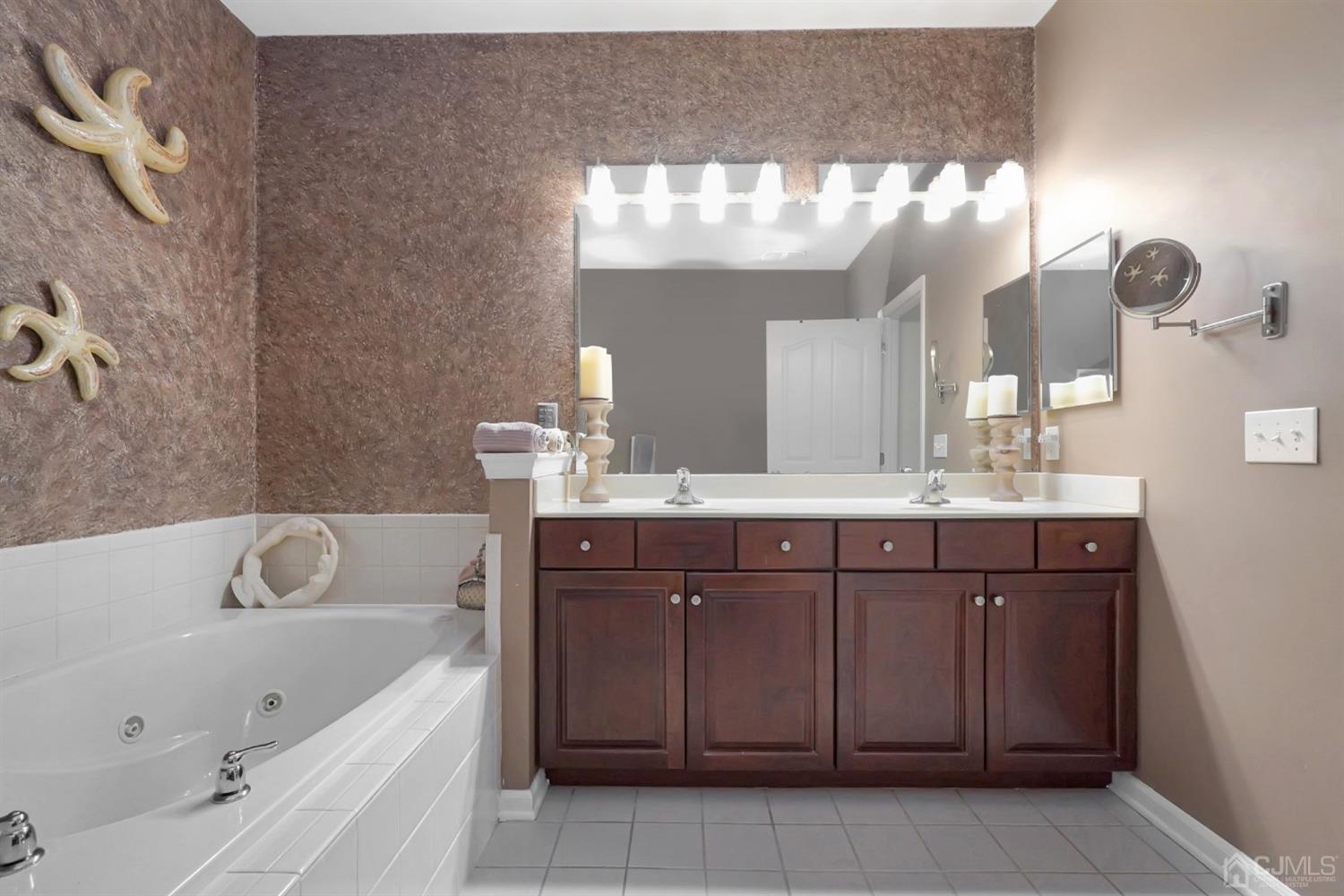 35 Diamond Spring Drive Monroe Township, NJ 08831 - Photo 14 of 32 a bathroom with a tub sink and mirror