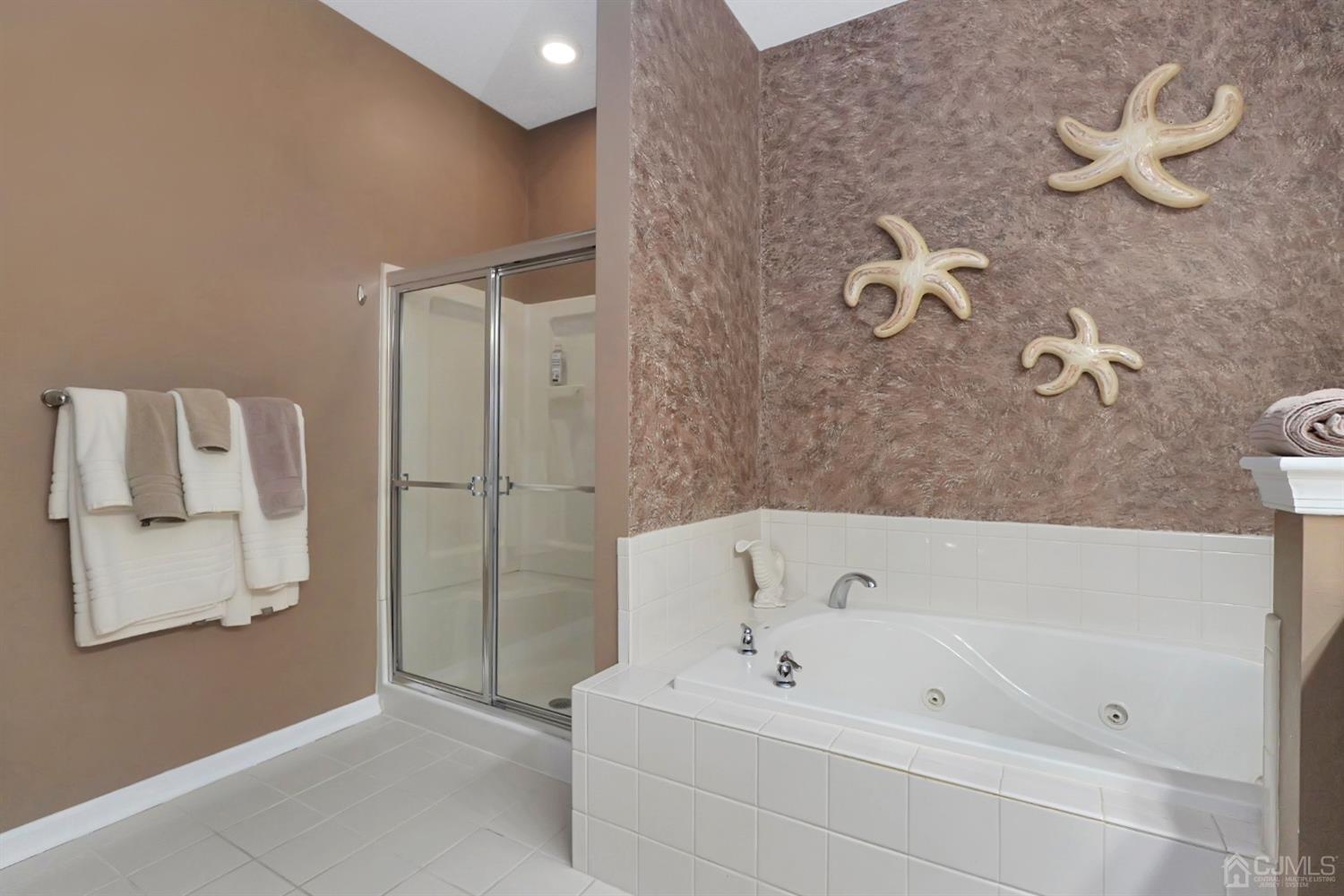 35 Diamond Spring Drive Monroe Township, NJ 08831 - Photo 15 of 32 a bathroom with a bathtub and shower
