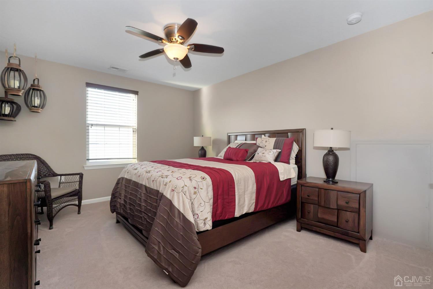 35 Diamond Spring Drive Monroe Township, NJ 08831 - Photo 19 of 32 a bedroom with a bed and a ceiling fan