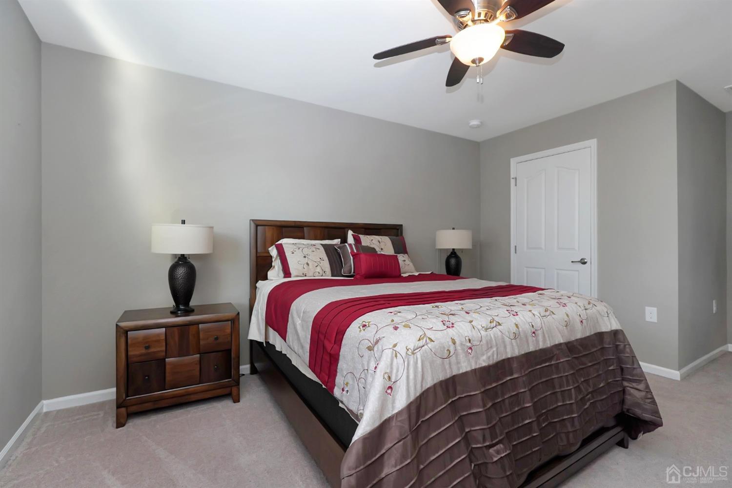 35 Diamond Spring Drive Monroe Township, NJ 08831 - Photo 20 of 32 a bedroom with a bed and a chandelier