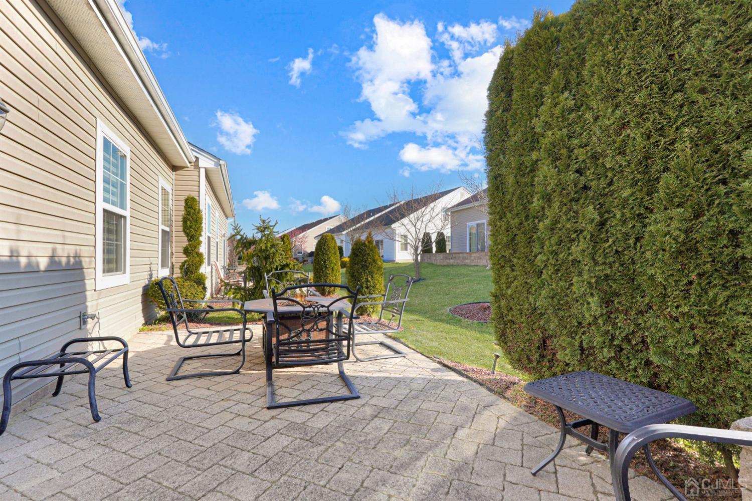 35 Diamond Spring Drive Monroe Township, NJ 08831 - Photo 27 of 32 a outdoor living space with furniture and a potted plant