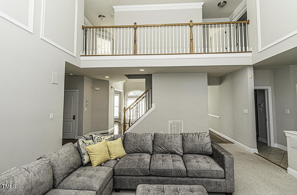 9244 Palm Bay Circle Raleigh, NC 27617 - Photo 13 of 29 a living room with furniture and a window