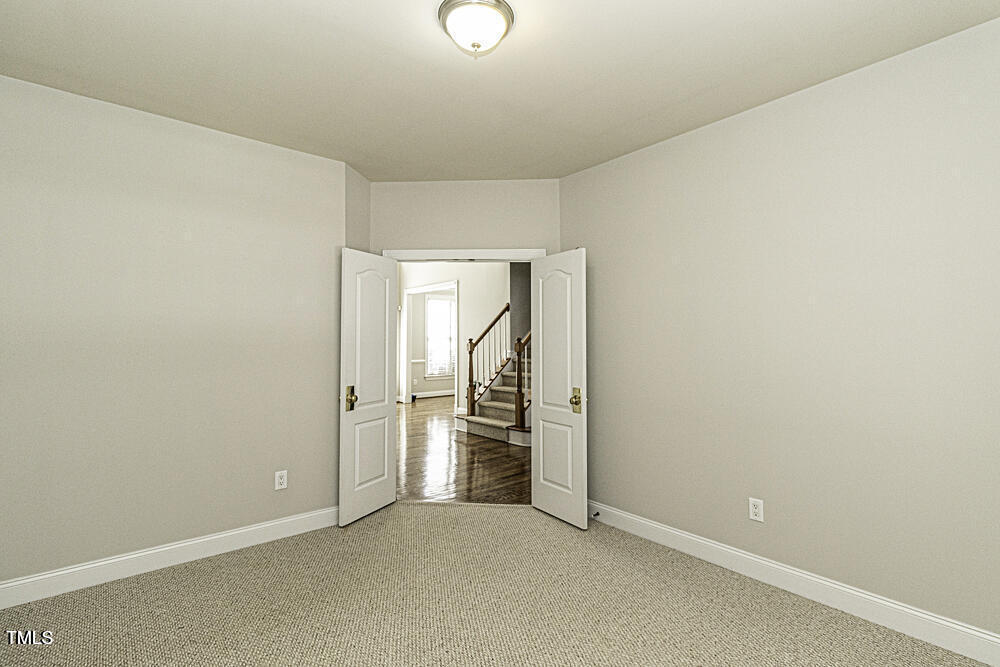 9244 Palm Bay Circle Raleigh, NC 27617 - Photo 19 of 29 a view of an empty room with a window