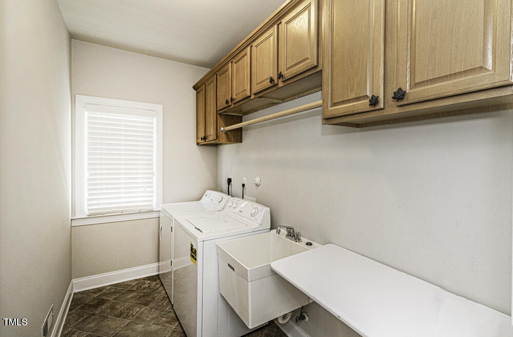9244 Palm Bay Circle Raleigh, NC 27617 - Photo 20 of 29 a utility room with dryer and washer