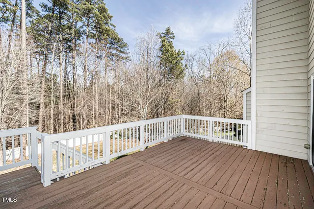 a view of a balcony with wooden floor