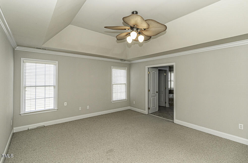 9244 Palm Bay Circle Raleigh, NC 27617 - Photo 21 of 29 a view of an empty room with a window