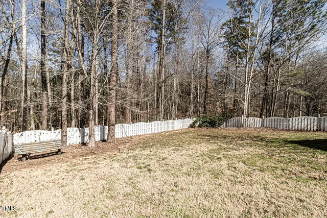 a view of a yard covered in snow