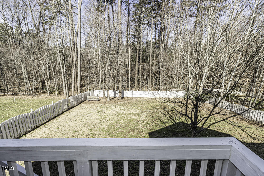 9244 Palm Bay Circle Raleigh, NC 27617 - Photo 5 of 29 a view of a yard with wooden fence