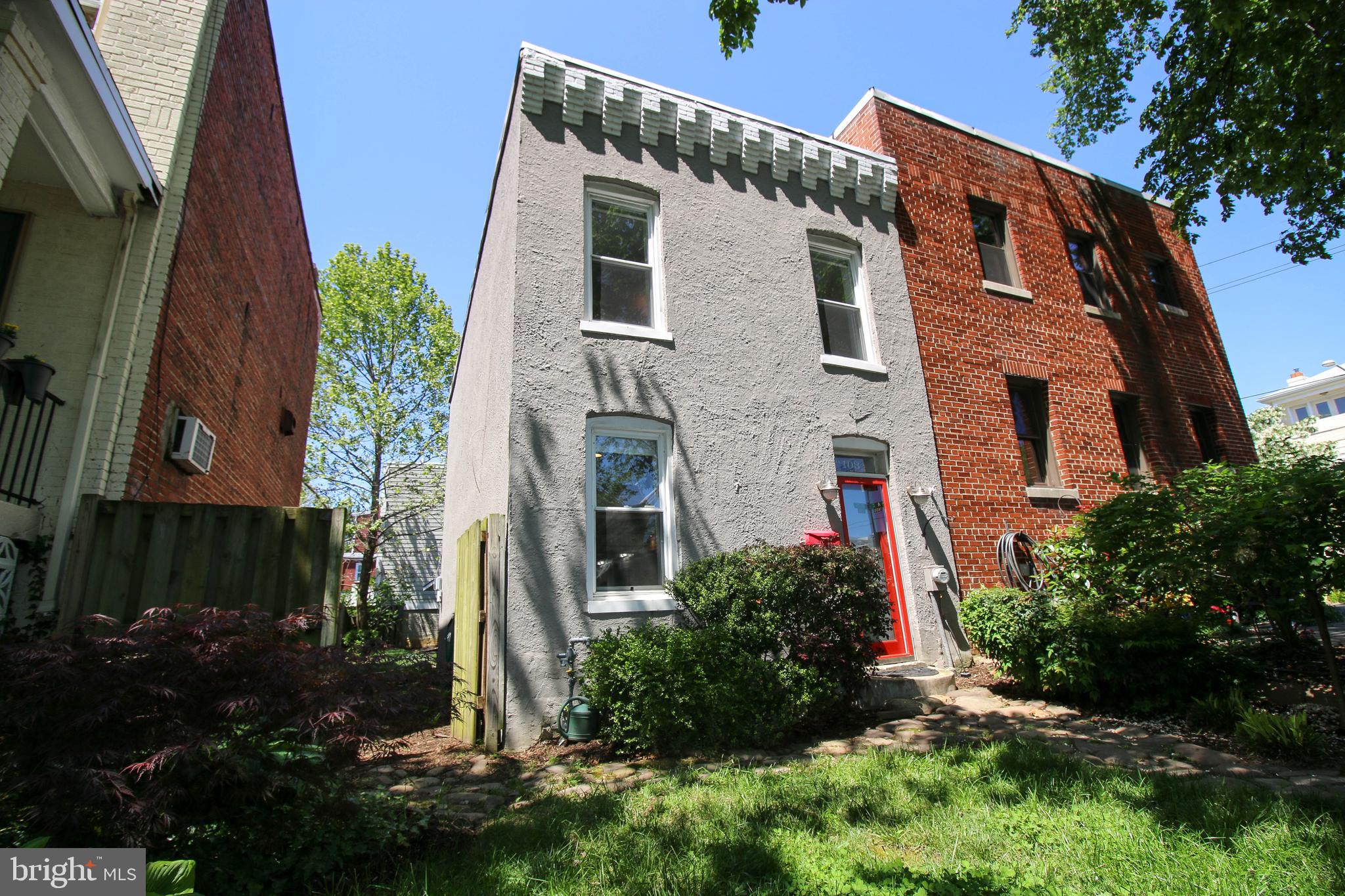 103 17th Street Southeast Washington, DC 20003 - Photo 1 of 26 a front view of a house with a yard
