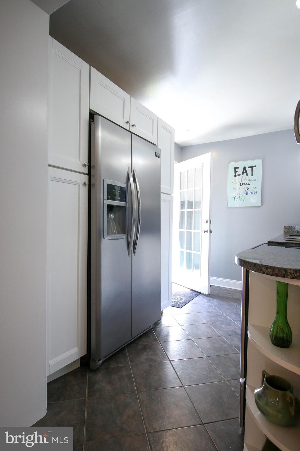 103 17th Street Southeast Washington, DC 20003 - Photo 11 of 26 a view of kitchen with furniture and wooden floor