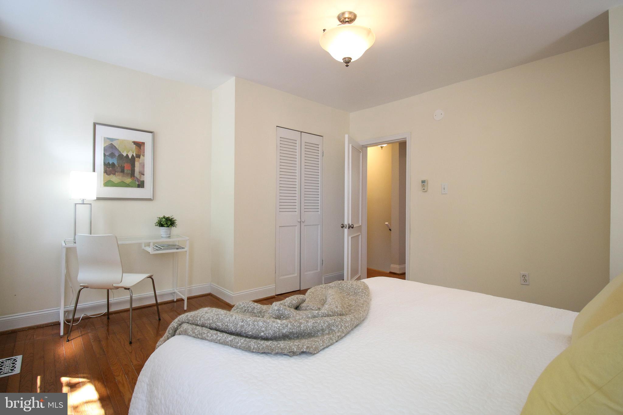 103 17th Street Southeast Washington, DC 20003 - Photo 15 of 26 a bedroom with a bed and chair