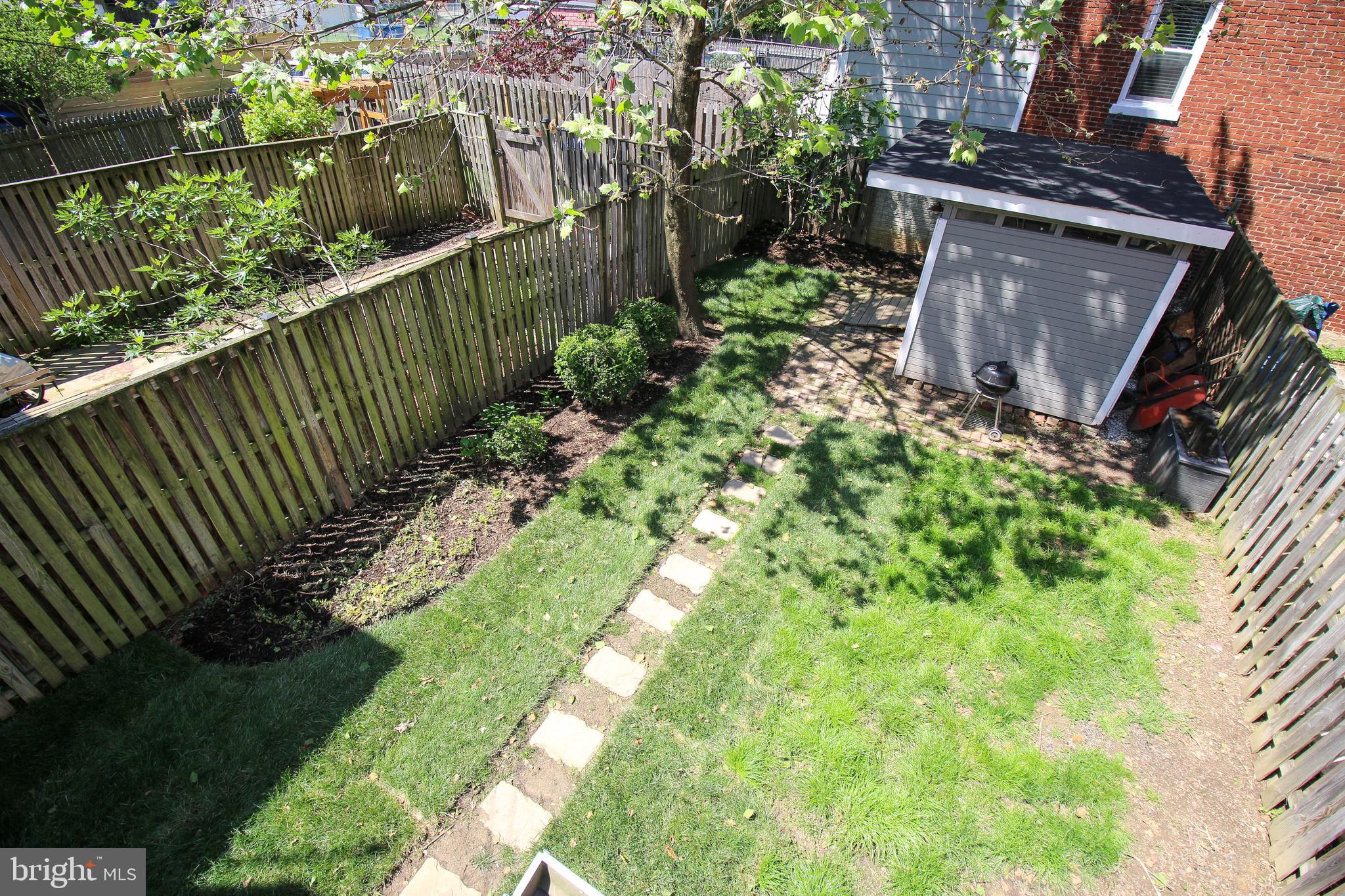 103 17th Street Southeast Washington, DC 20003 - Photo 24 of 26 a view of a garden with wooden fence