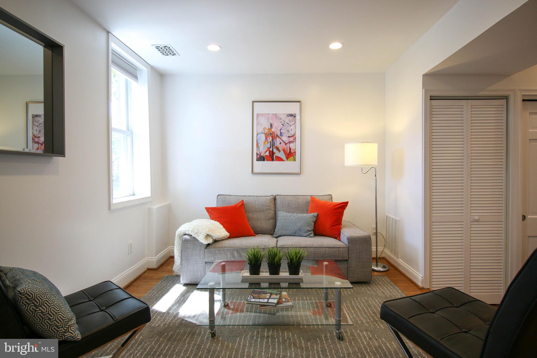103 17th Street Southeast Washington, DC 20003 - Photo 4 of 26 a living room with furniture and a window