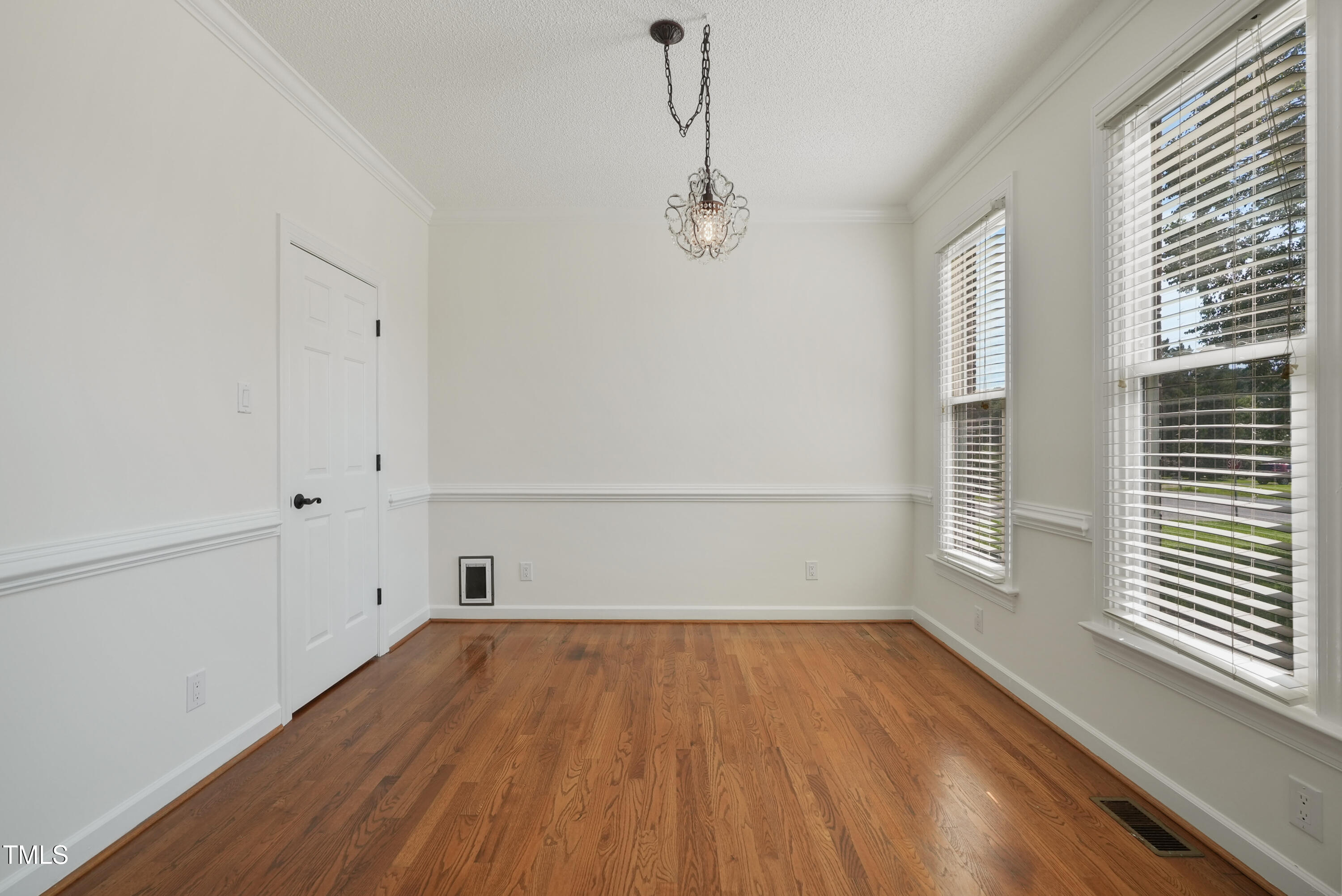 1010 Warren Road Erwin, NC 28339 - Photo 15 of 54 a view of empty room with wooden floor and fan