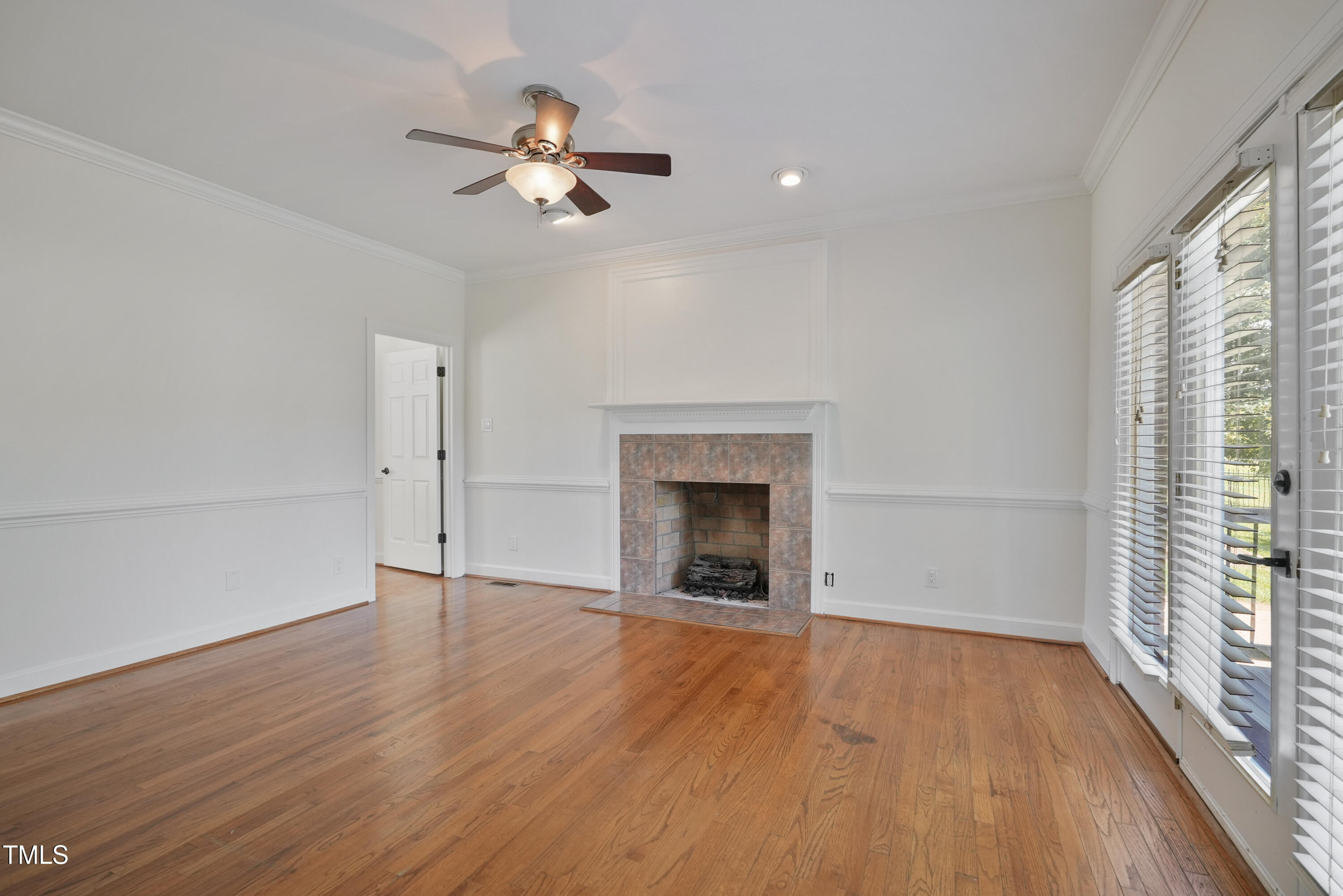 1010 Warren Road Erwin, NC 28339 - Photo 28 of 54 a view of an empty room with a window and wooden floor