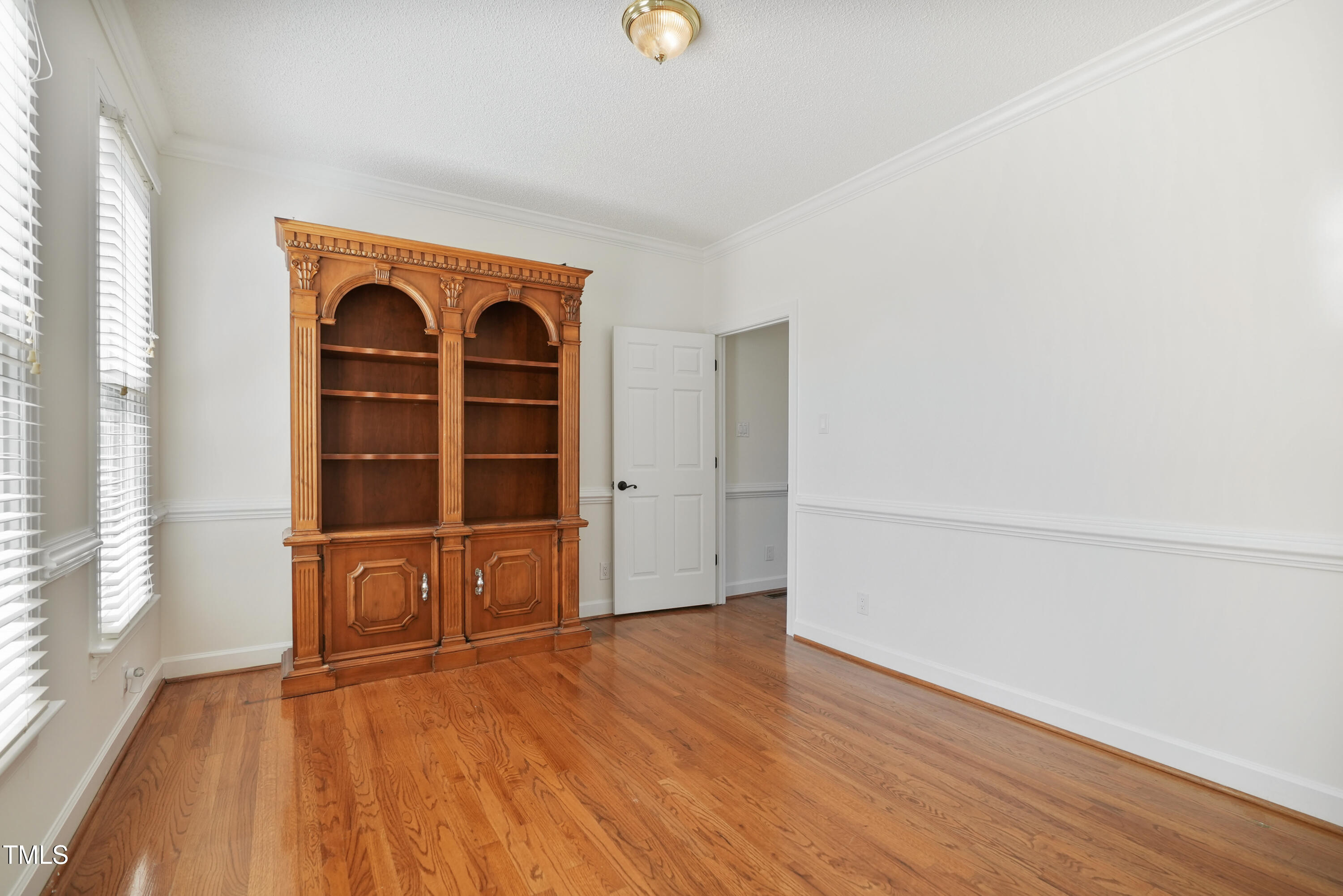 1010 Warren Road Erwin, NC 28339 - Photo 29 of 54 an empty room with wooden floor and windows