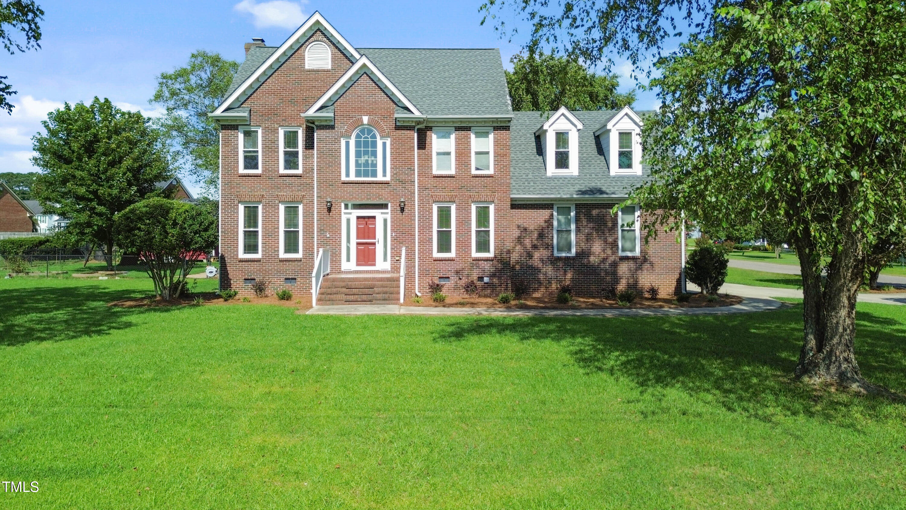 1010 Warren Road Erwin, NC 28339 - Photo 3 of 54 a front view of a house with a yard