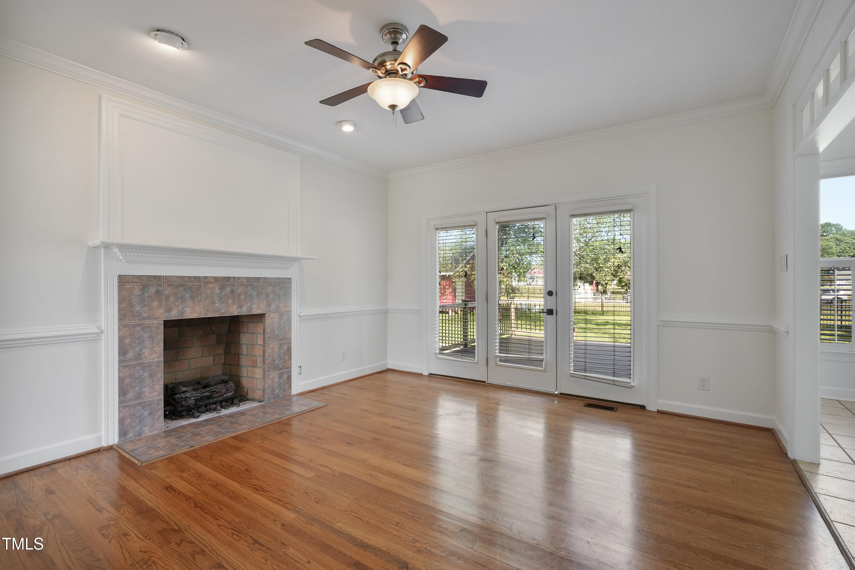 1010 Warren Road Erwin, NC 28339 - Photo 31 of 54 a view of an empty room with exposed radiator and fireplace