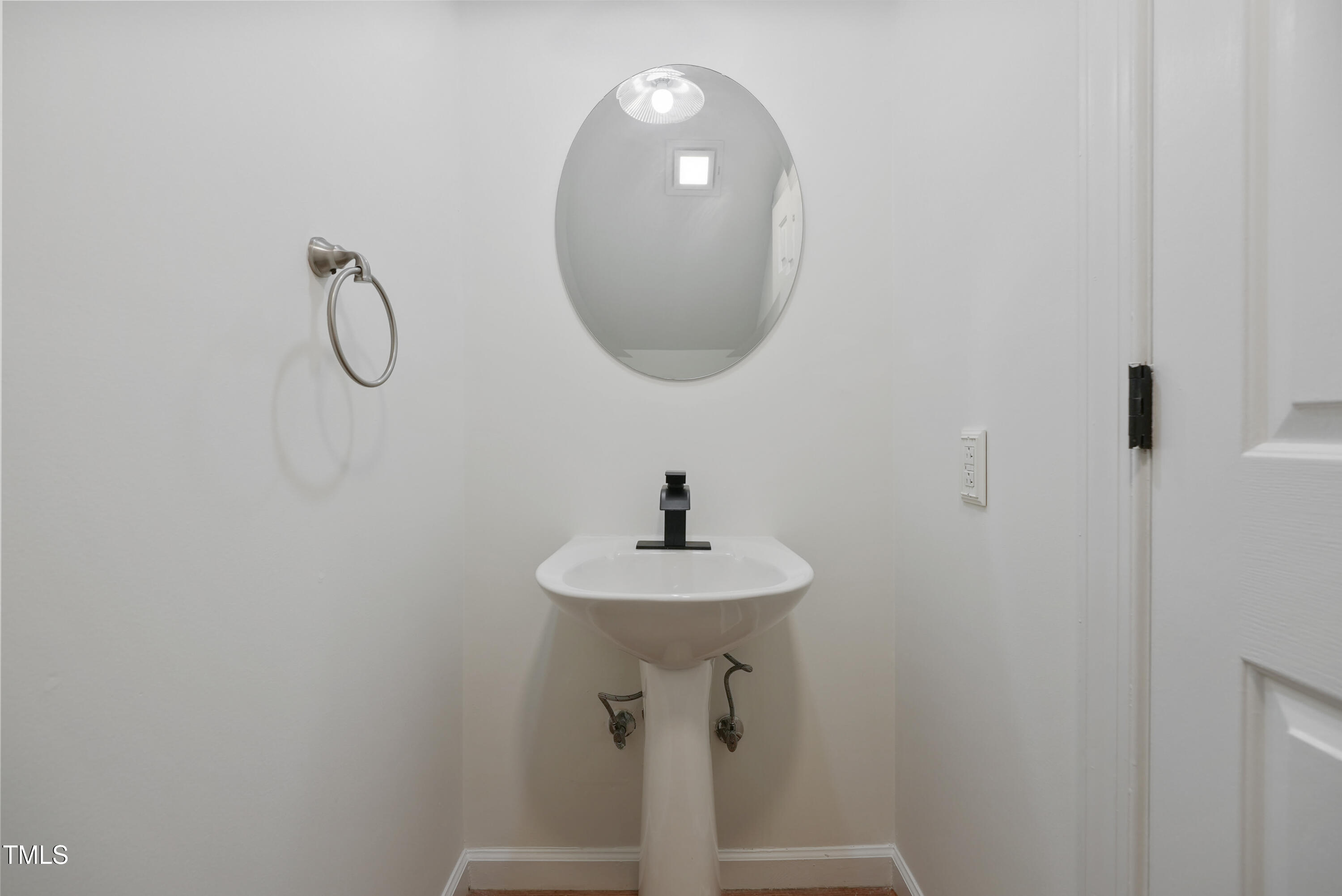 1010 Warren Road Erwin, NC 28339 - Photo 33 of 54 a bathroom with a sink and a mirror