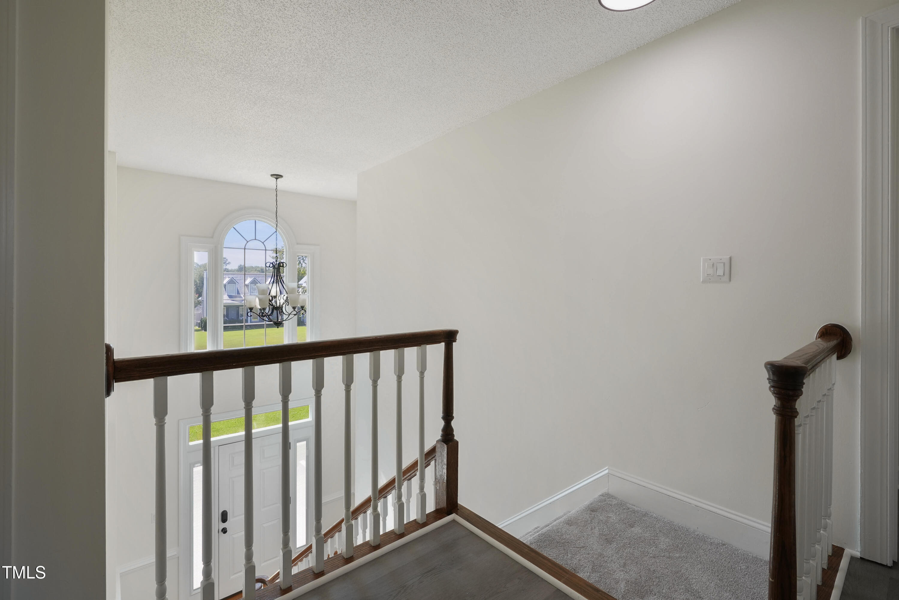 1010 Warren Road Erwin, NC 28339 - Photo 35 of 54 a view of a hallway with wooden floor and staircase