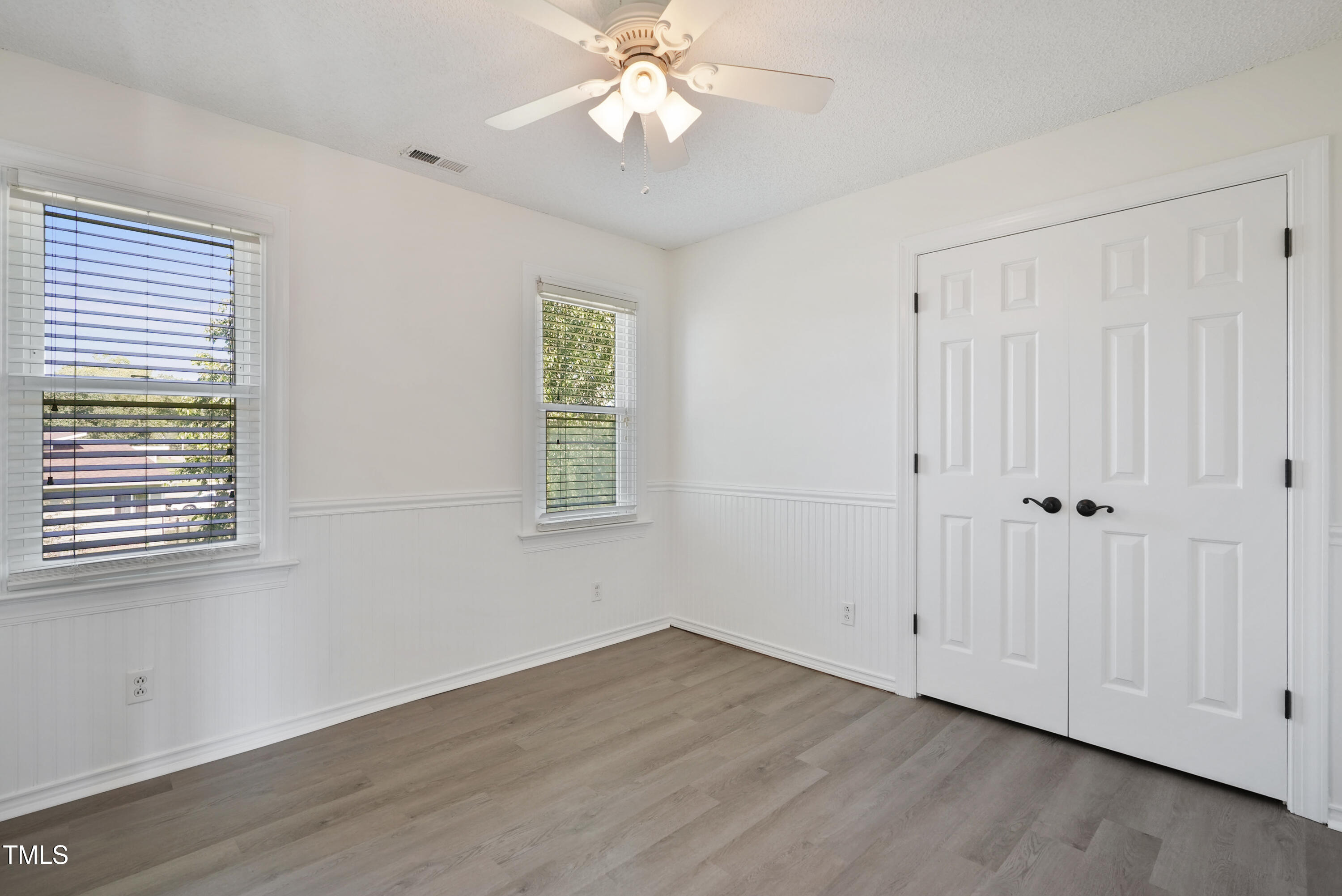 1010 Warren Road Erwin, NC 28339 - Photo 36 of 54 a view of an empty room with wooden floor and a window