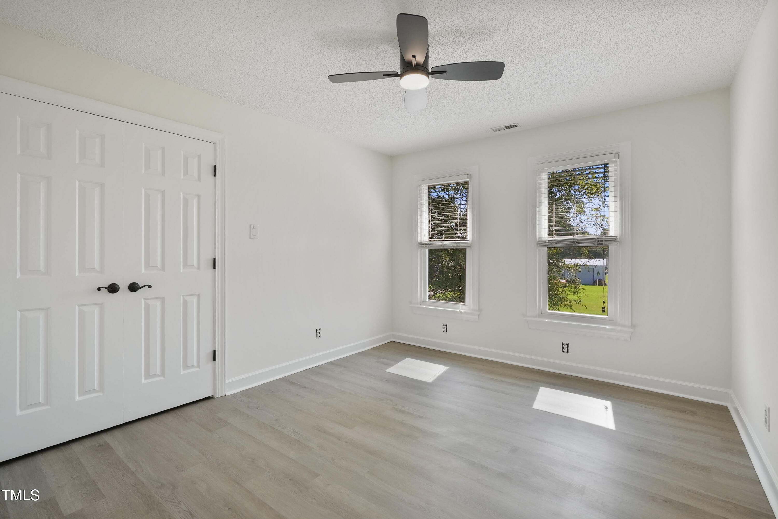 1010 Warren Road Erwin, NC 28339 - Photo 39 of 54 a view of an empty room with window and wooden floor