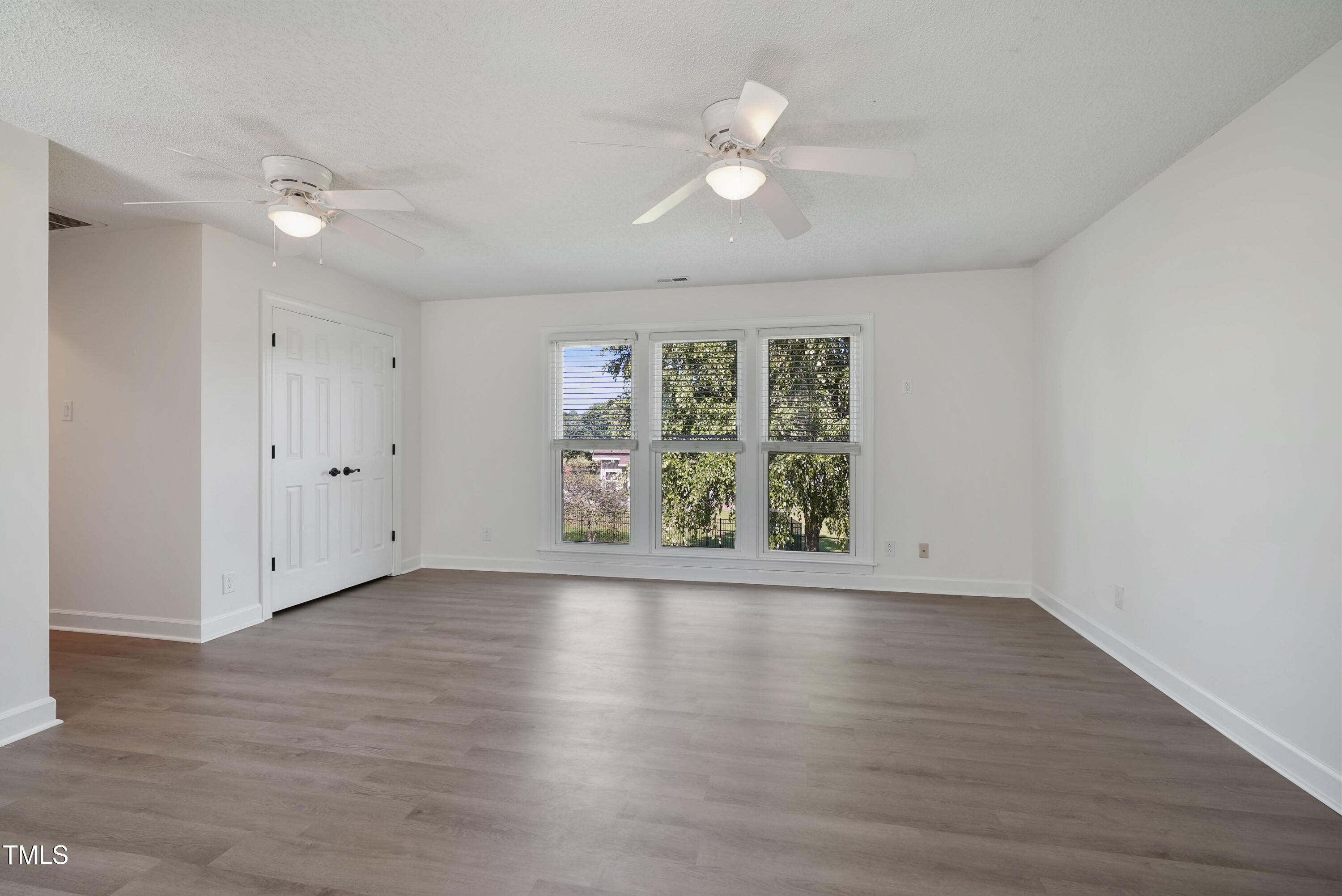 1010 Warren Road Erwin, NC 28339 - Photo 41 of 54 a view of an empty room with wooden floor and window