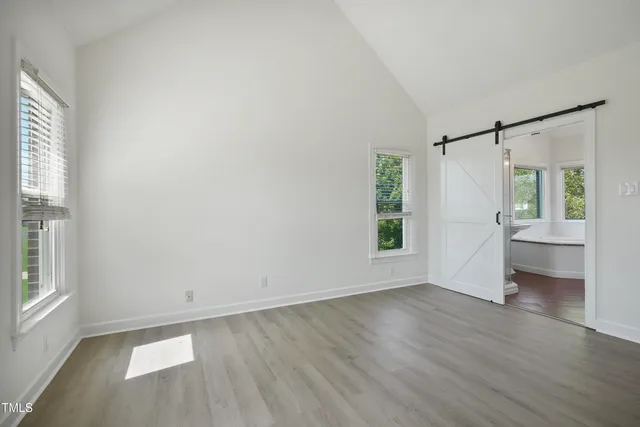 a bathroom with a granite countertop sink a bathtub and shower