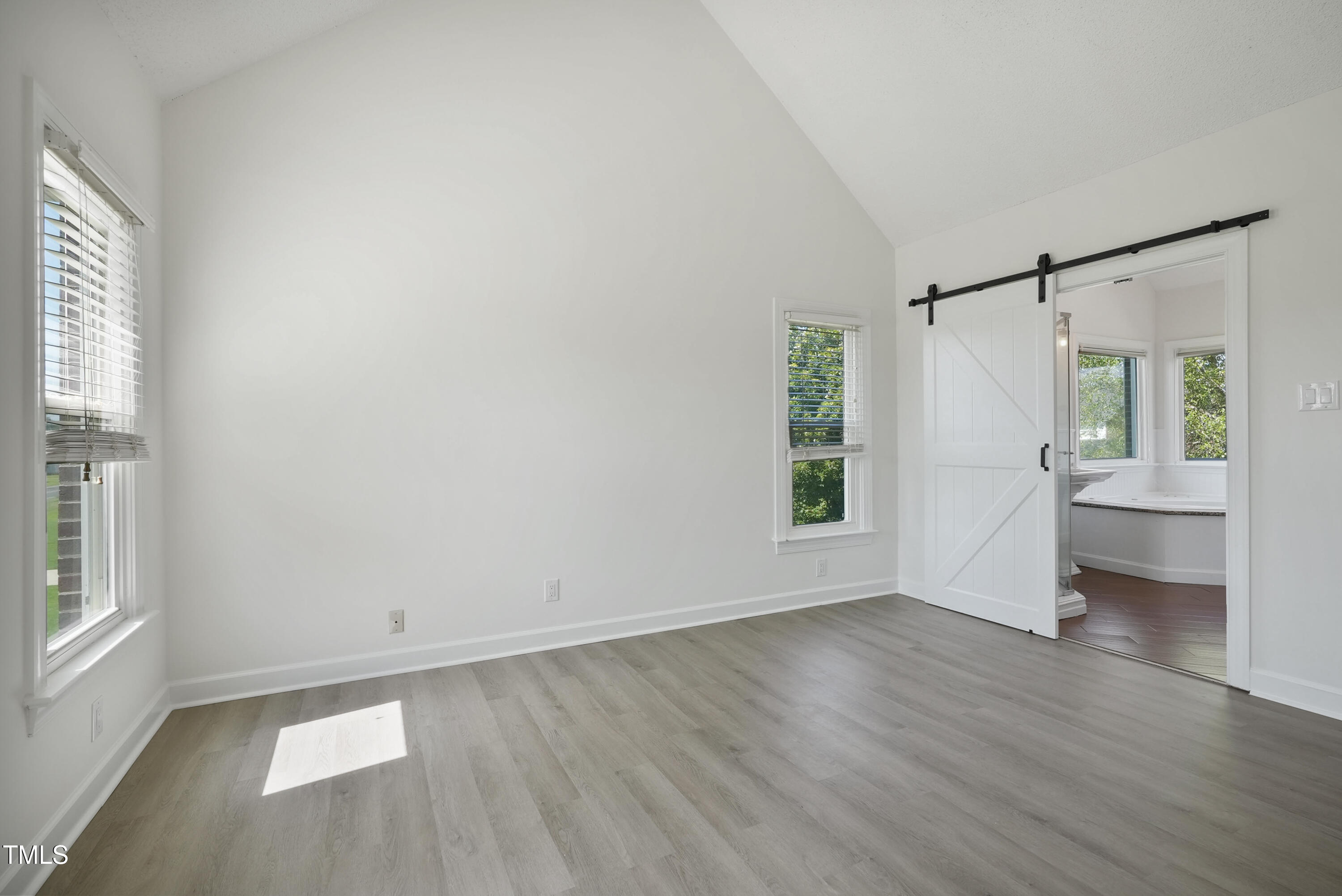 1010 Warren Road Erwin, NC 28339 - Photo 42 of 54 an empty room with wooden floor and windows