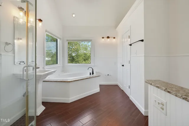 a bathroom with a bathtub and a shower