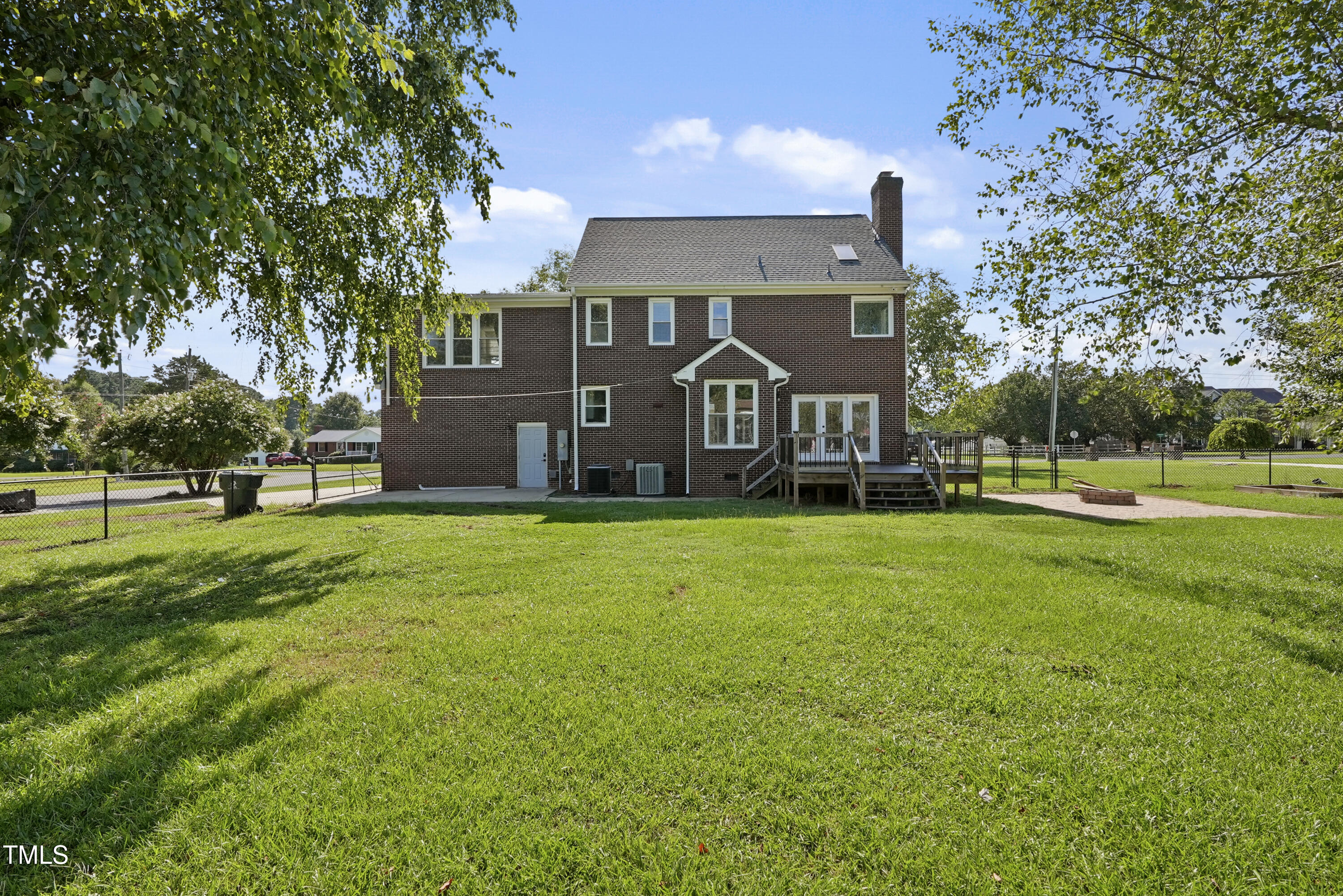 1010 Warren Road Erwin, NC 28339 - Photo 54 of 54 a view of a big house with a big yard and large trees