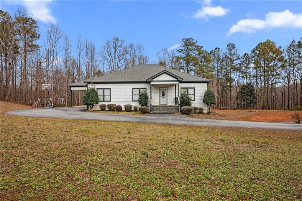 Welcome to 4 private acres nestled in Forsyth