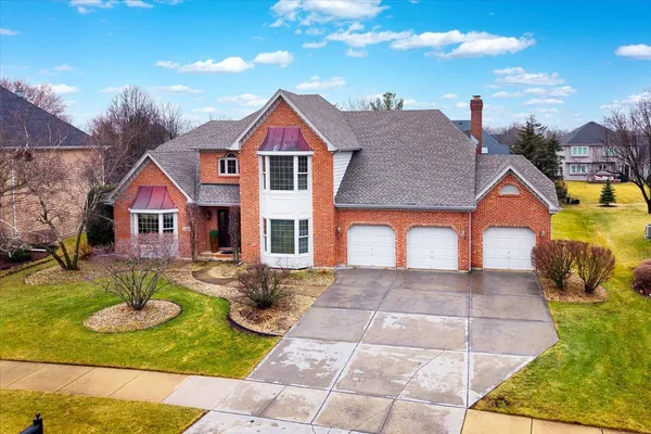 a view of house with yard outdoor seating and swimming pool