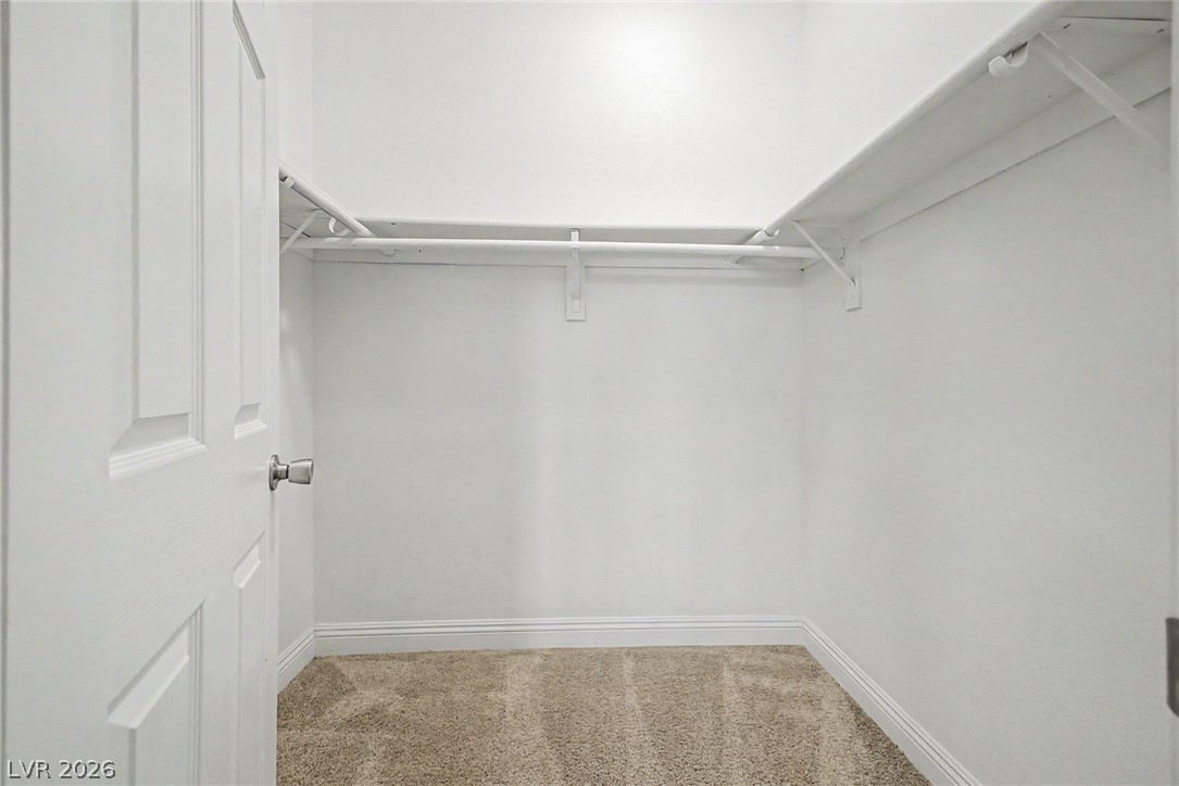 2316 Ramsgate Drive Henderson, NV 89074 - Photo 22 of 28 Ample storage solutions await in this walk-in closet, ready to organize your wardrobe with ease.