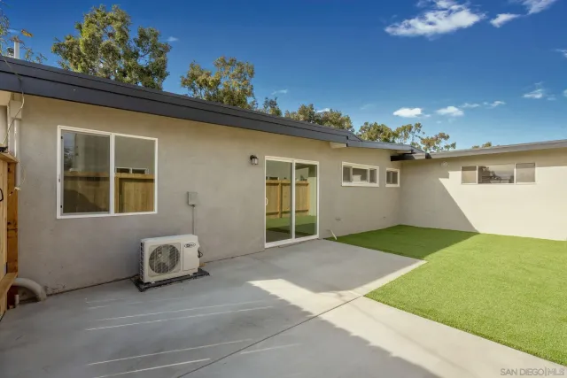 a house view with a backyard space